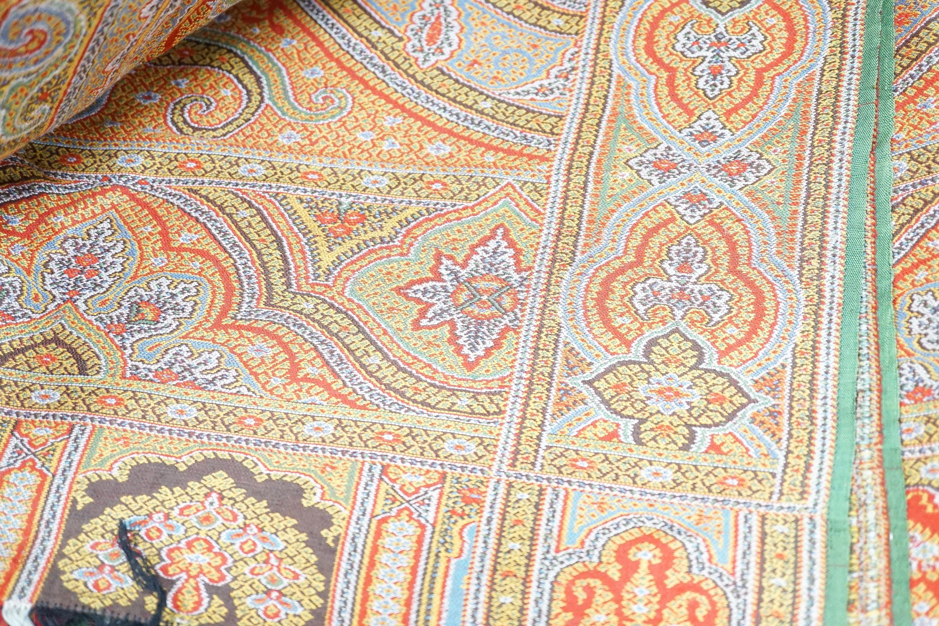 A large wool Paisley shawl, 340 x 164cm